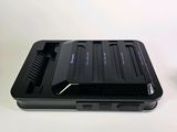 a cell phone that is sitting on a table next to a cup