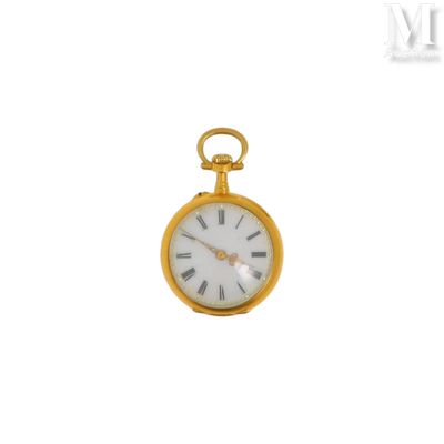 une montre de poche en or avec des chiffres romains sur le cadran