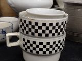 a stack of cups sitting on a black table
