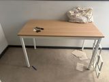 a small table with a bag on top of it