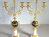 pair of antique brass candelabs with black and white marble vases