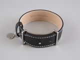 black leather dog collar with white stitching and a metal clasp
