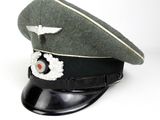 a hat with a badge on it on a white background