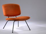 an orange chair with a black metal frame and a white background