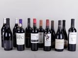 several bottles of wine are lined up on a table