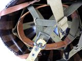 a close up of a helmet with a strap on it