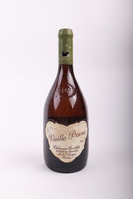 bottle of wine with a label on it sitting on a white surface