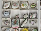a white box filled with a lot of different types of jewelry