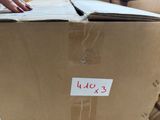 a cardboard box with a sticker on it sitting on a table