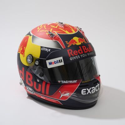 the helmet of a red bull racing driver on a white background