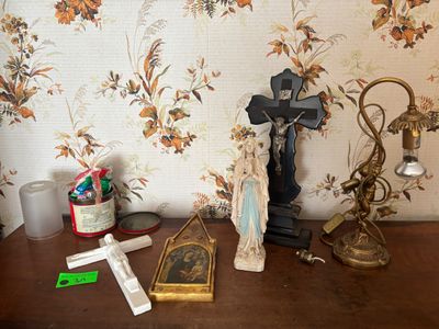 a picture of a wooden table with a cross and other items on it