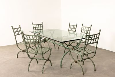a glass table with four chairs and a glass top
