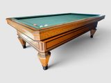 a pool table with a green cloth on it