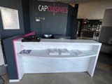 a picture of a white counter with a pink counter top