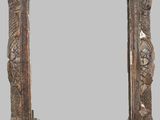 an old wooden picture frame with a decorative design on it