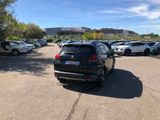 many cars parked in a parking lot in a parking lot