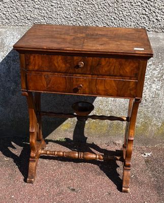 a small wooden table with a drawer on top of it