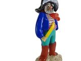a figurine of a man with a sword and a hat