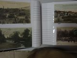 an open book with pictures of a town in it