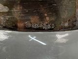 a close up of a metal pot on a table