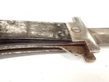 a close up of a knife on a white surface