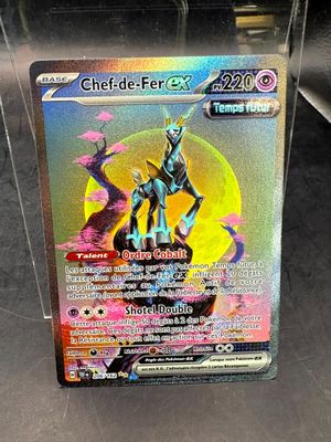 a close up of a pokemon card in a display case