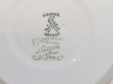 a close up of a plate with a bird on it