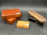 several different types of wooden boxes on a black surface
