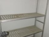 a metal shelf that has some shelves on top of it