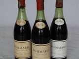 three bottles of wine that are sitting on a table