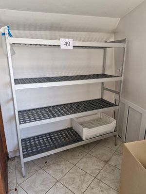 a metal shelf with a number on it in a room