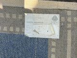 a picture of a purse with a card attached to it