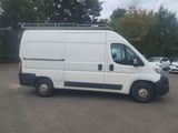 a white van that is parked in a parking lot