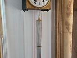 a clock that is hanging on the wall in the room