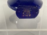 a glass display case with a blue object in it