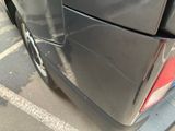 a close up of a car ' s tail end with a sticker on it