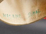 a close up of a hat with writing on it