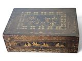 an old wooden box with a decorative design on it