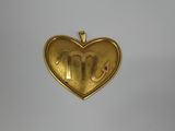 a close up of a gold heart shaped locke with the letter m on it