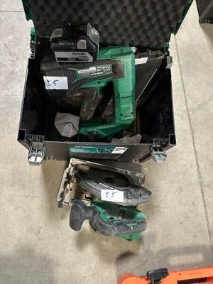 a tool box with tools inside of it on the floor