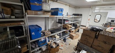 a room filled with lots of boxes and boxes on the shelves