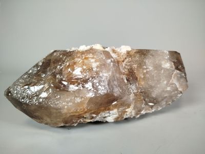 crystal on a white surface with a light gray background