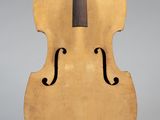 un objet en forme de violoncelle posé sur un support et doté d'un long manche