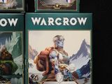 three boxes of wargrow cards sitting on a black surface
