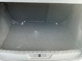 a trunk of a car that is empty with the trunk door open