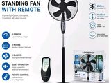 an image of a stand fan with remote control in front of a box