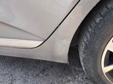 a close up of a car ' s tire with a hole in the side