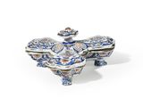 a blue and white porcelain box with a bird on top