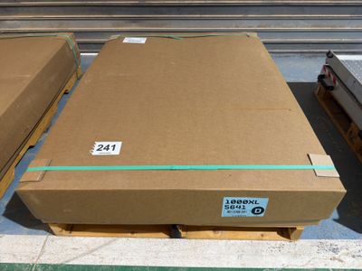 two cardboard boxes are stacked on top of each other on a pallet