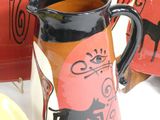 three mugs that are sitting next to each other on a table